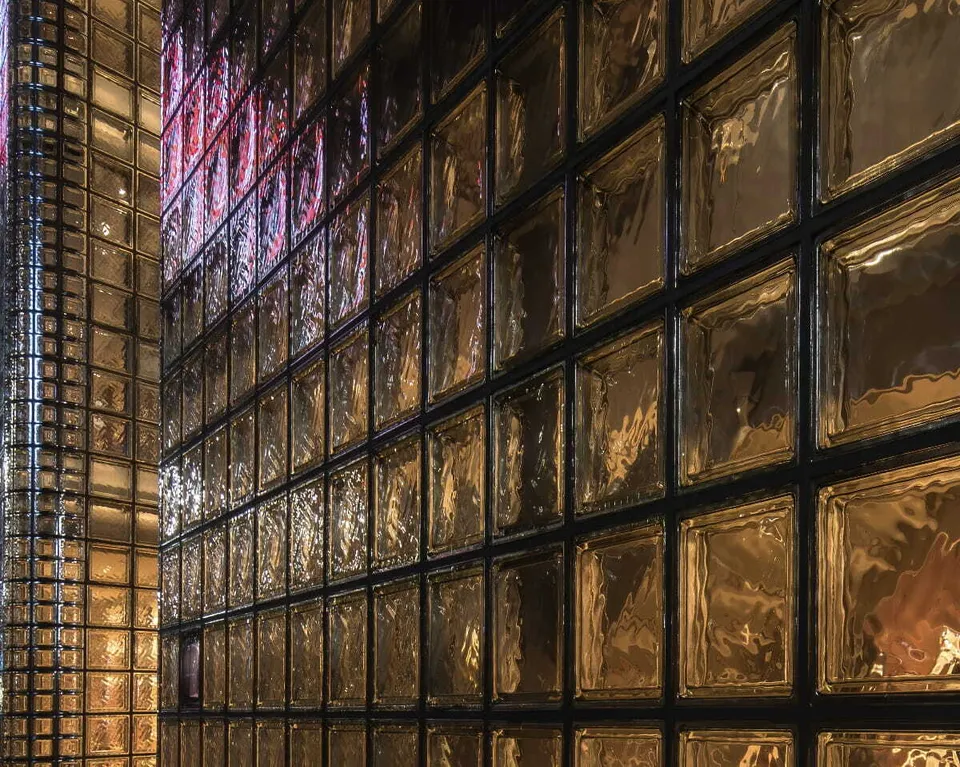 Exterior view of the illuminated facade of Maison Hermes made of glass blocks Ginza Tokyo Japan21